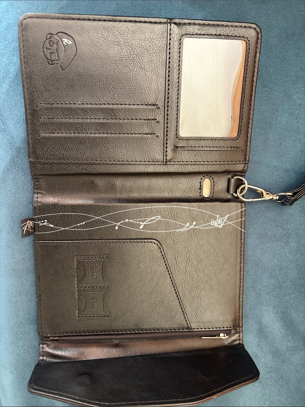 TNT RAyan Black Embossed Leather Passport Wallet with Signature Logo - Picture 9 of 10